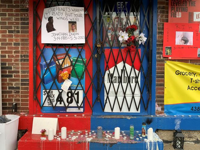 Memorials left for 36-year-old Jonathan Dupin, who was shot to death on May 31, 2021 at 2 Brothers Market on North 28th Street