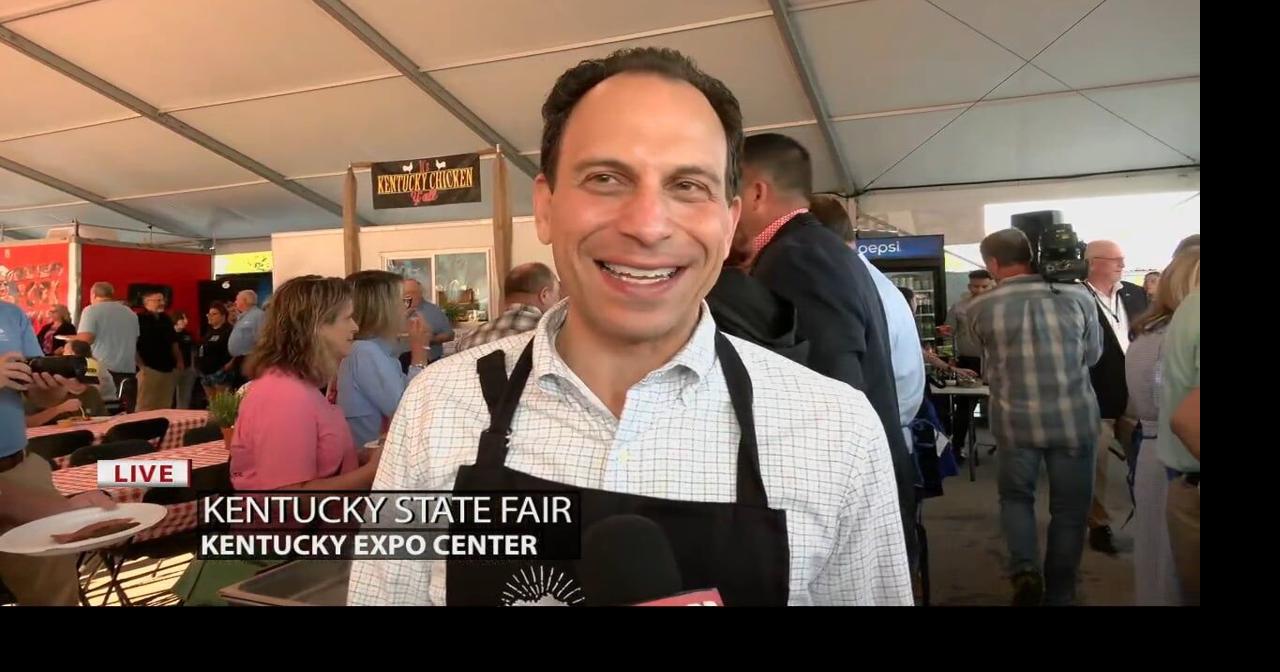 Louisville Mayor Craig Greenberg serves guests at Kentucky State Fair