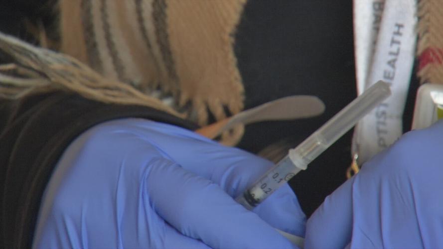 A COVID-19 vaccine at Baptist Health Floyd's drive-thru clinic