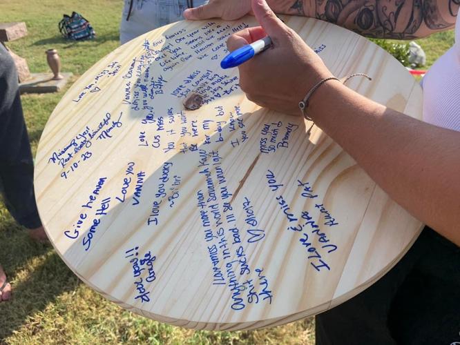 Signed board at Savannah Duckworth vigil.jpg