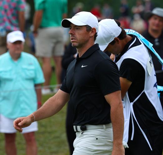 Rory McIlroy walks down 13th fairway.JPG