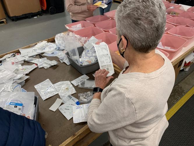 Volunteers at Louisville-based SOS assemble medical kits bound for Ukraine