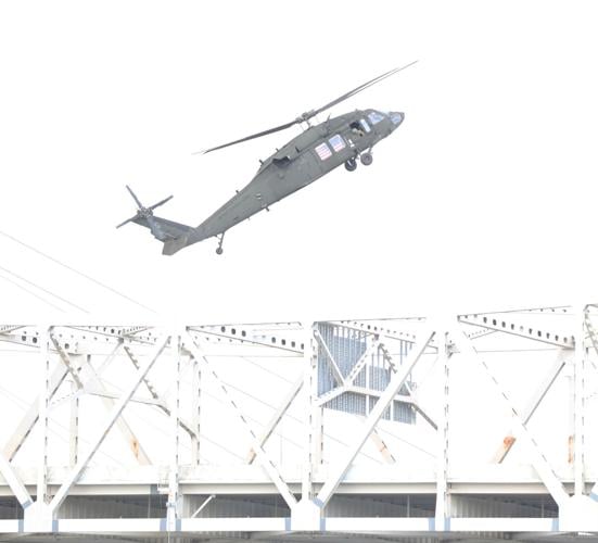 Blackhawk hovers near crowd.JPG