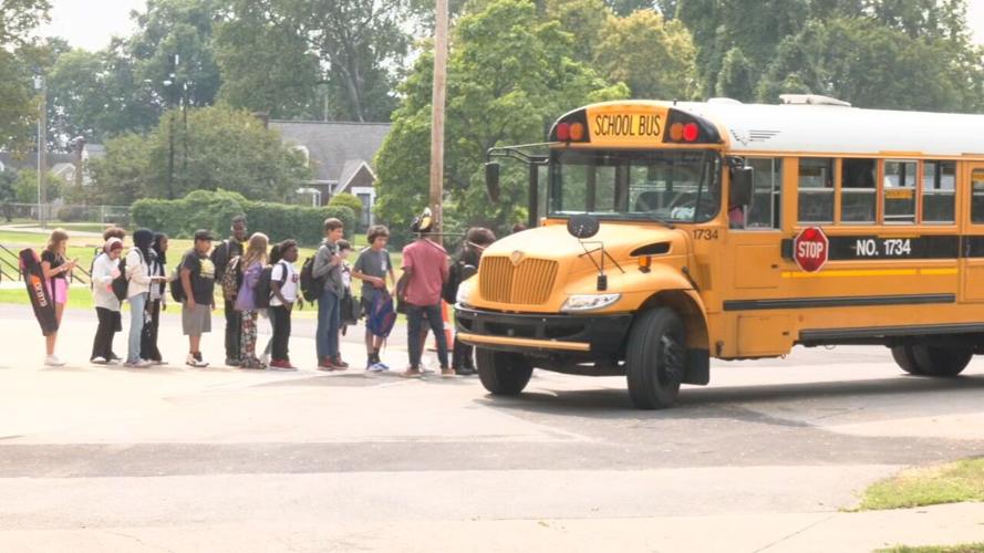 JCPS students wait in line to board bus - 8.21.23