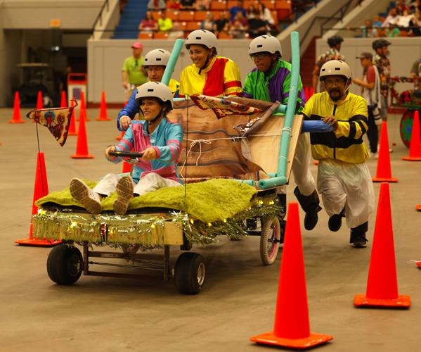 Jockeys run in the Bed Races.JPG