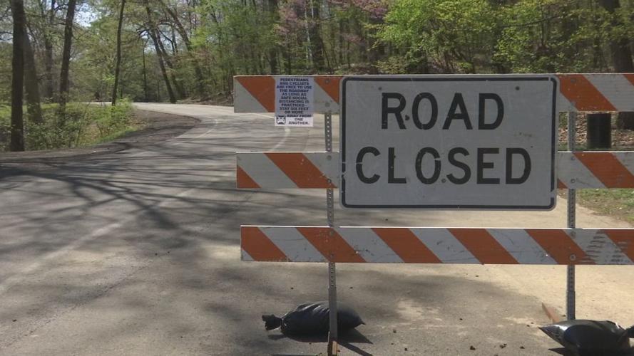 Road closed sign at Louisville park due to COVID-19