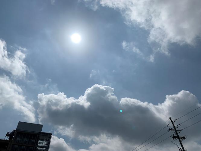 Sun shines down between clouds in Louisville