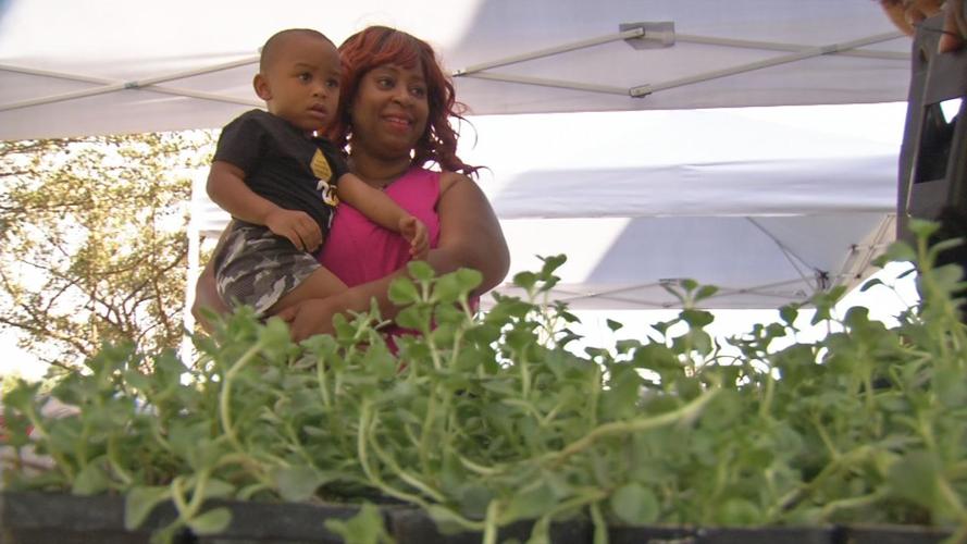 Woman and child at Green Wall Build in Park DuValle