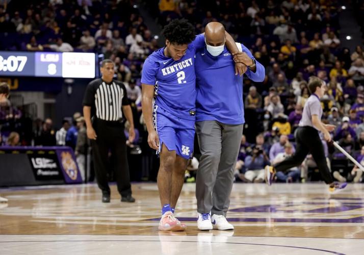 Kentucky guard Sahvir Wheeler is assisted off court against LSU