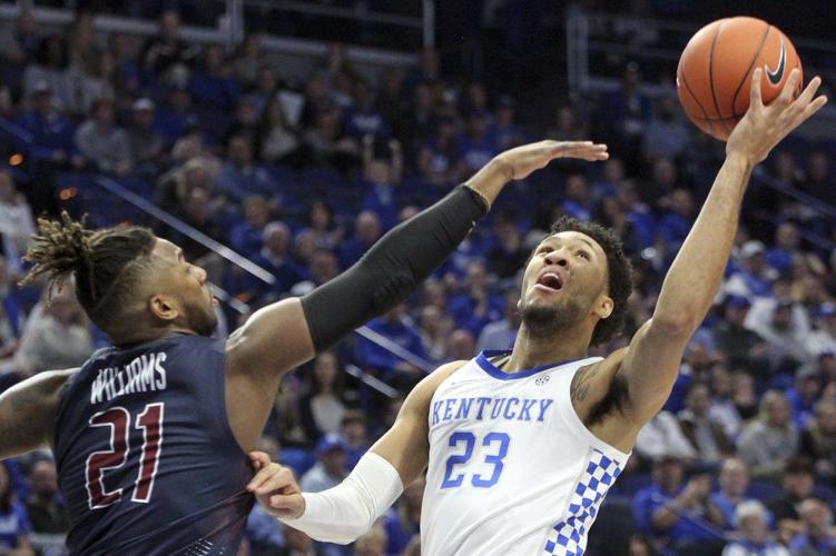 Kentucky's EJ Montgomery (23) shoots while defended by Fairleigh Dickinson's Elyjah Williams (21)