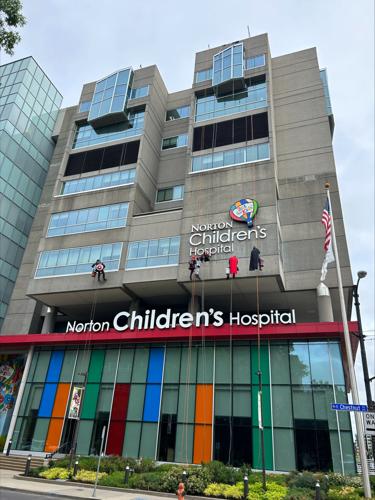 Window washers rappel from Norton Children's Hospital dressed as superheroes