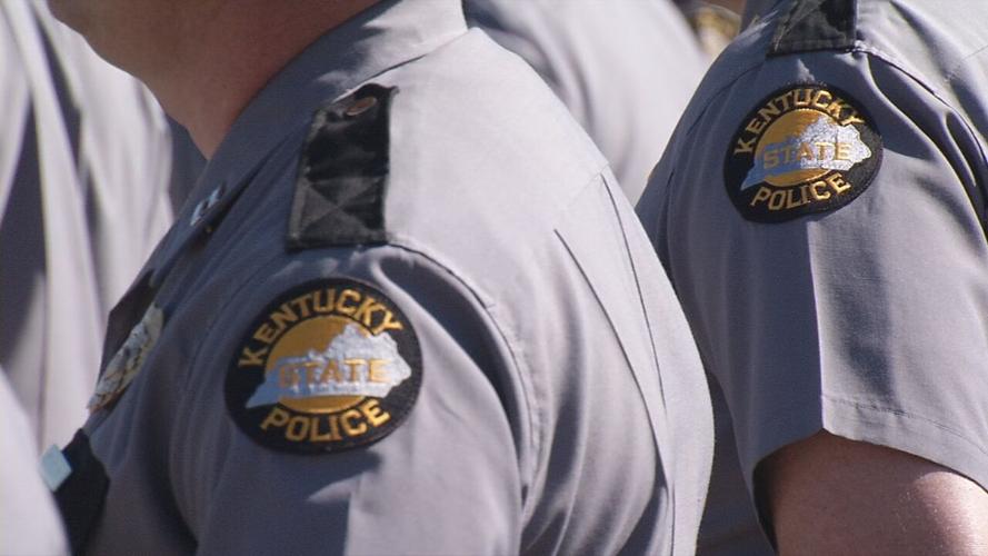 Kentucky State Troopers stand shoulder to shoulder