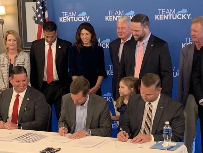 Gov. Andy Beshear signs at Kentucky Horse Racing Commission