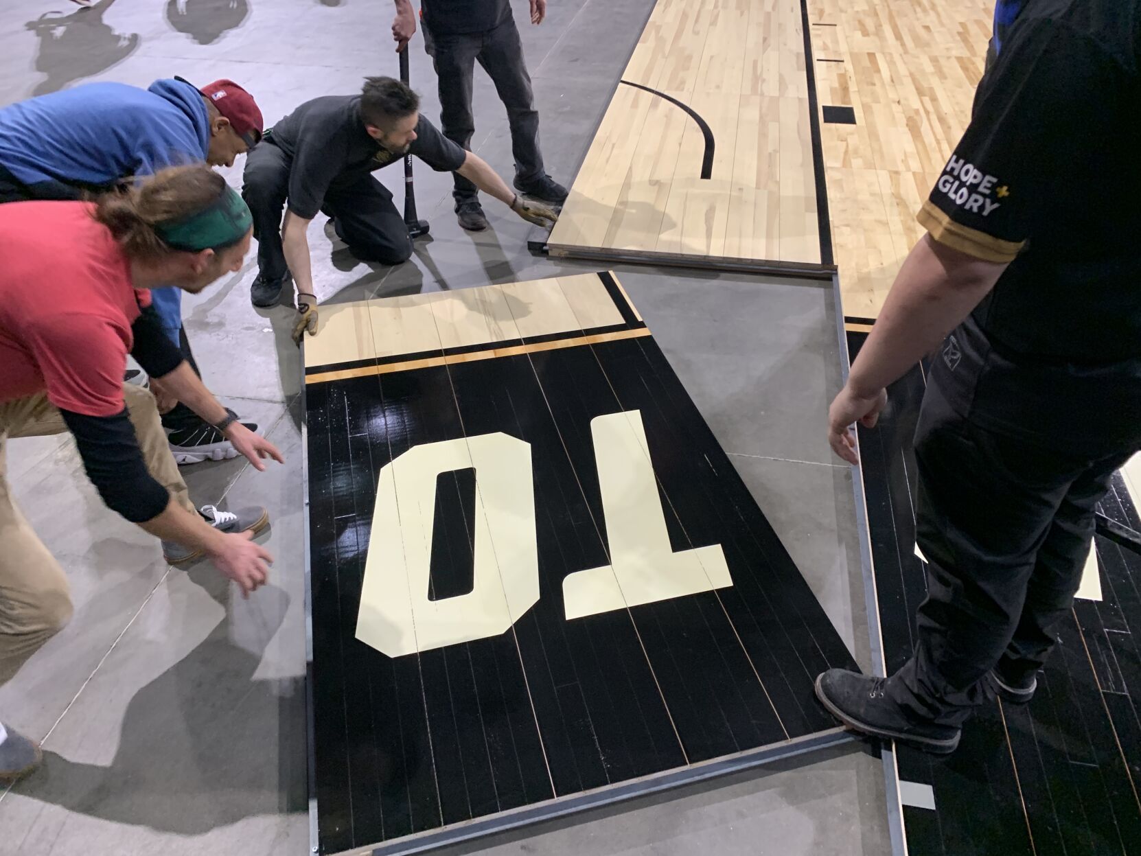 NCAA FLOOR  BEING INSTALLED AT YUM CENTER 3-21-2023 (6).JPG