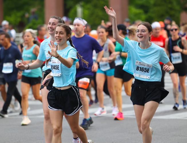 Girls run in marathon race.JPG