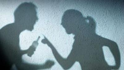 Silhouette of couple arguing
