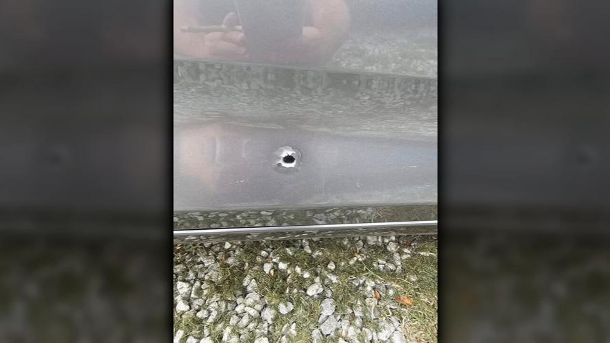 Bullet hole in car shot on Baxter Avenue