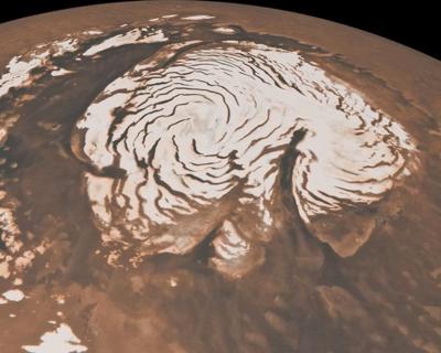 Hot cocoa or Martian snow? How Mars' ice caps developed dark, spiral-shaped bands...
