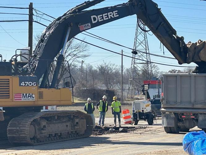 Men work at construction on River Road - March 10, 2025.jpg