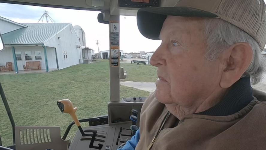 Bill Gallrein Sr. uses a tractor lift on Gallrein Farms to keep working