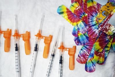 Syringes near kids band aids