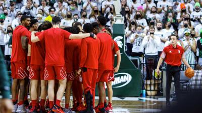 Louisville basketball huddle