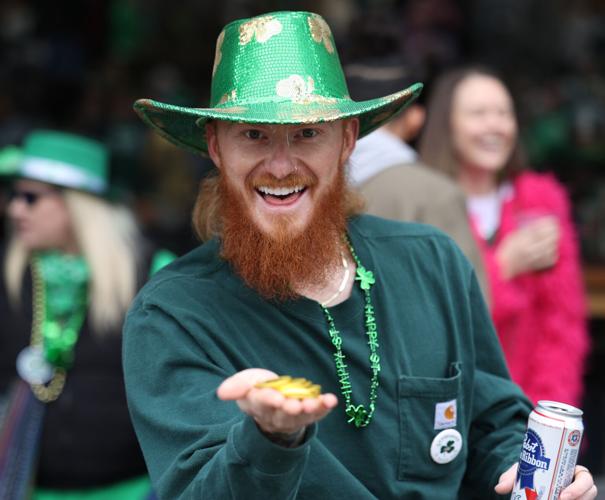 Man holds coins at parade