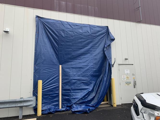 Tarp over warehouse on Robards Lane damaged by storm