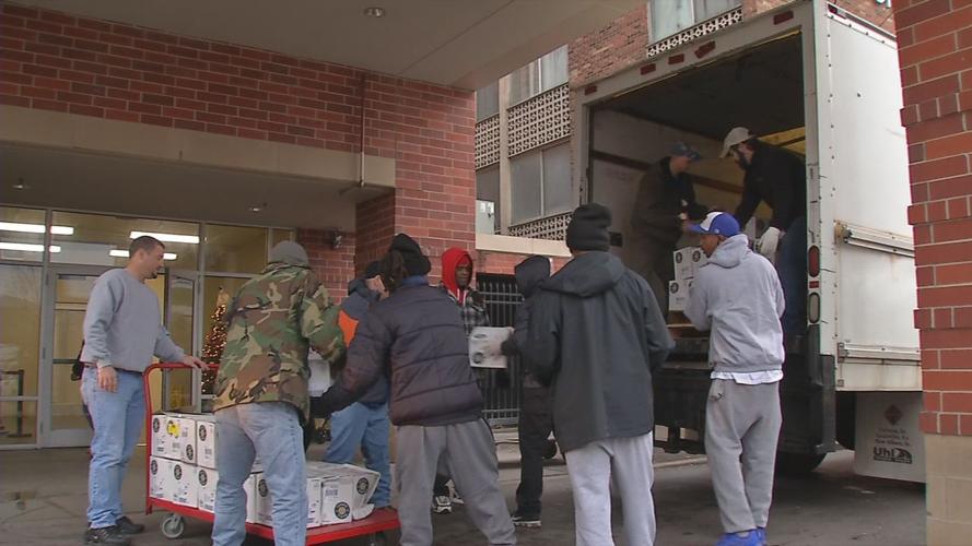 Food unloaded from truck by non-profit staff