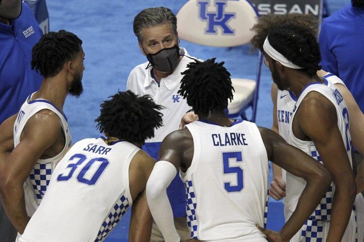 Kentucky head coach John Calipari, top center, instructs his team
