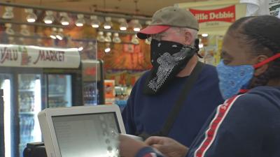 Masked person in grocery store