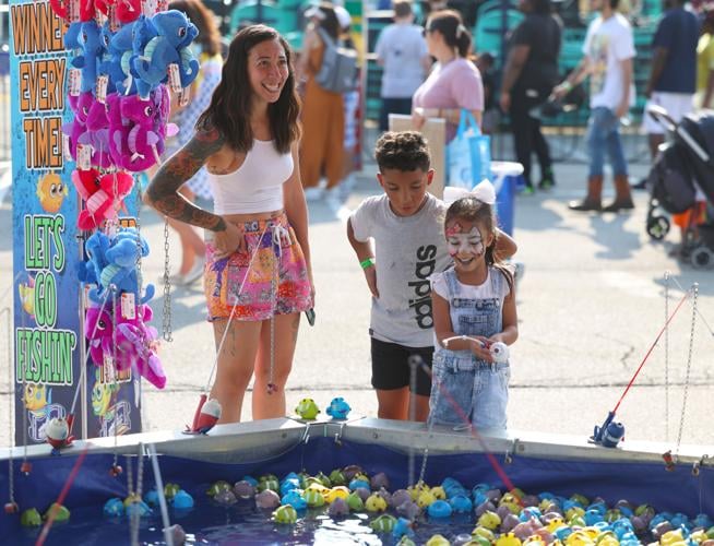 Family plays game at Midway.JPG