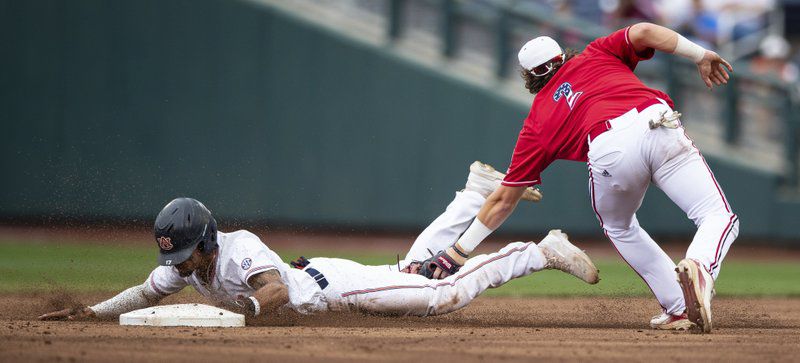 Auburn's Will Holland steals second base