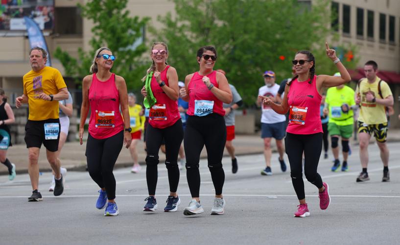 Group of women run down Broadway.JPG