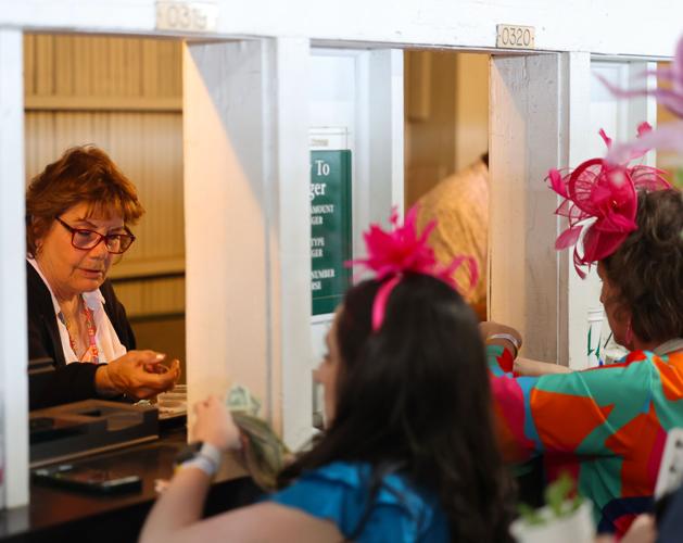 Woman takes wagers on Derby day.JPG