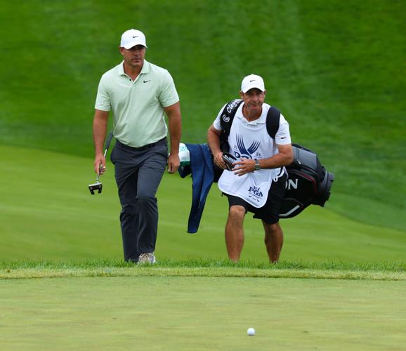 Brooks Koepka walks to 12th green.JPG