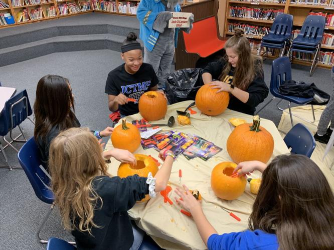 Jack O Lantern Stroll - Students Carving.jpeg