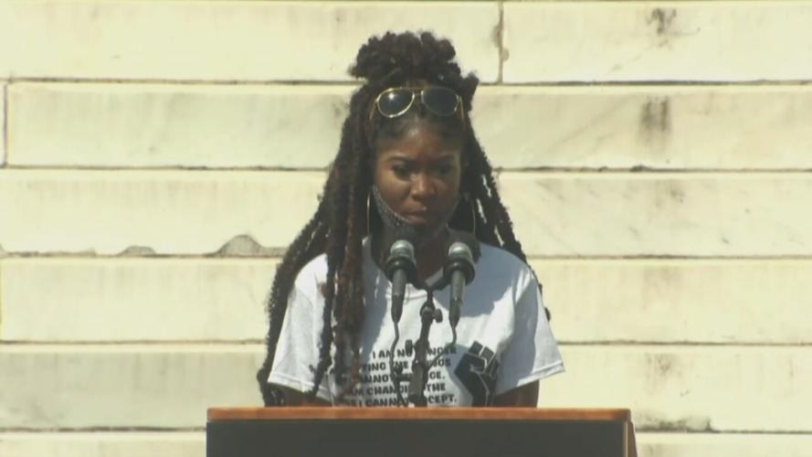 Alaya Eastman, a student from Washington, D.C.'s Trinity Washington University speaks during a rally at Lincoln Memorial