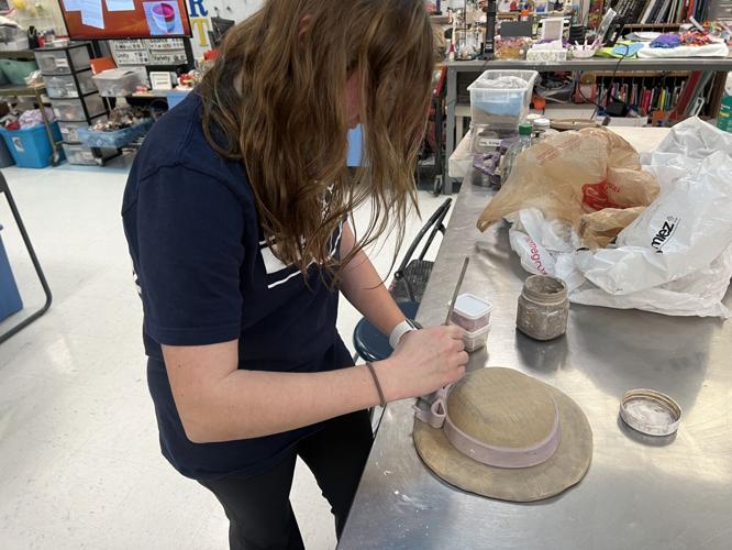 A student at Providence High School in Clarksville designs a bowl for the 2023 Empty Bowl Dinner