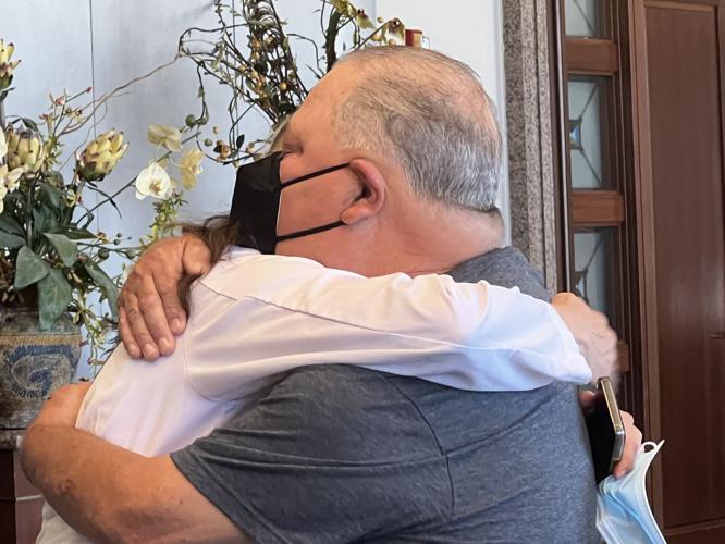 Munday hugs Dr. Stephanie Moore.