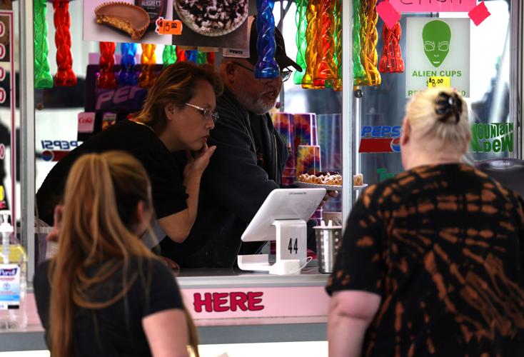 Food vendor at the Chow Wagon serves a customer