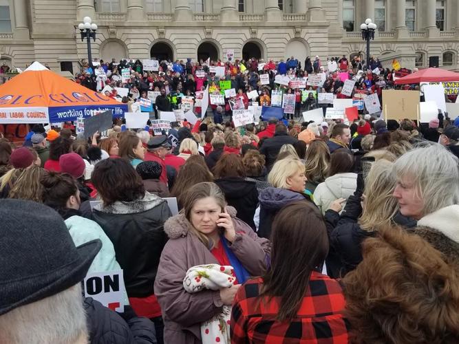 Teachers, public workers rally against pension reform bill on Capitol steps