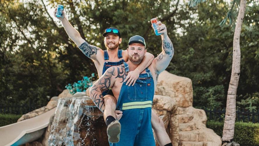 Skyler Ipock and Aaron Brothers hold up beers