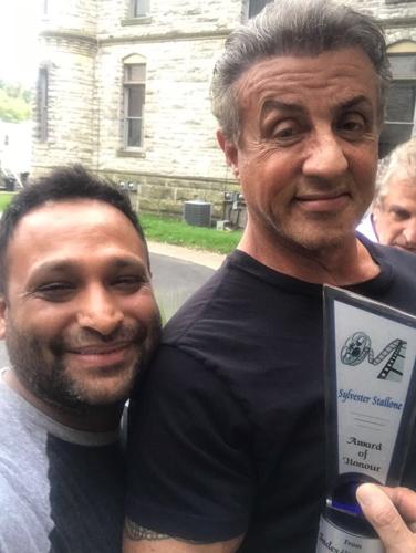 Inder Kumar poses with Sylvester Stallone