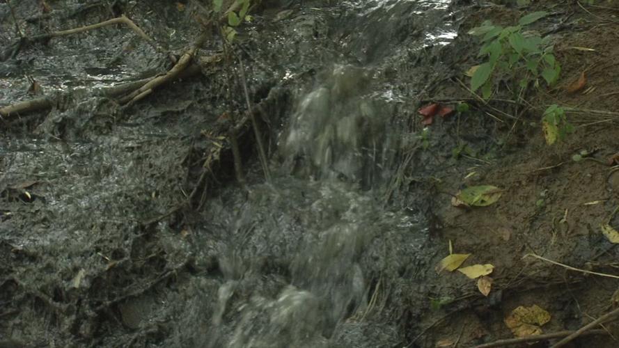 Sewage runoff after collapse of sewage treatment plant in Hunters Hollow, Kentucky