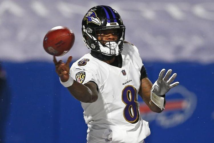 Baltimore Ravens quarterback Lamar Jackson (8) throws a pass