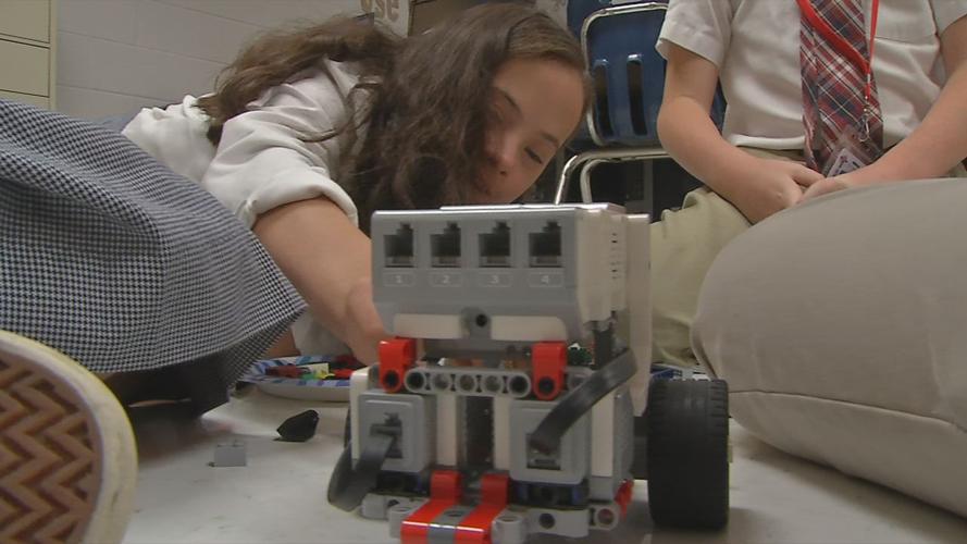 Kate Voss, a Christian Academy of Louisville student with Down Syndome, in robotics class with classmates