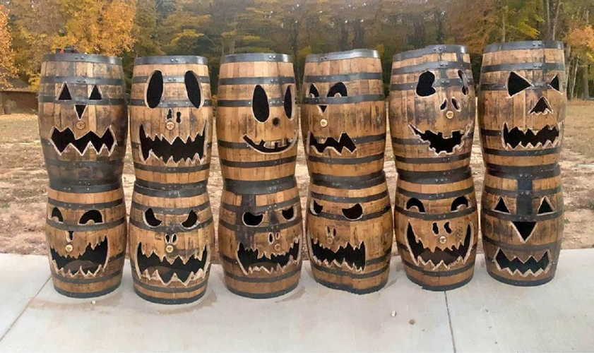 Bourbon barrels with Jack-o'-Lantern faces