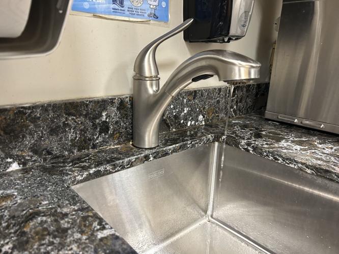 Louisville Water demonstrates turning on indoor faucets during freezing temperatures