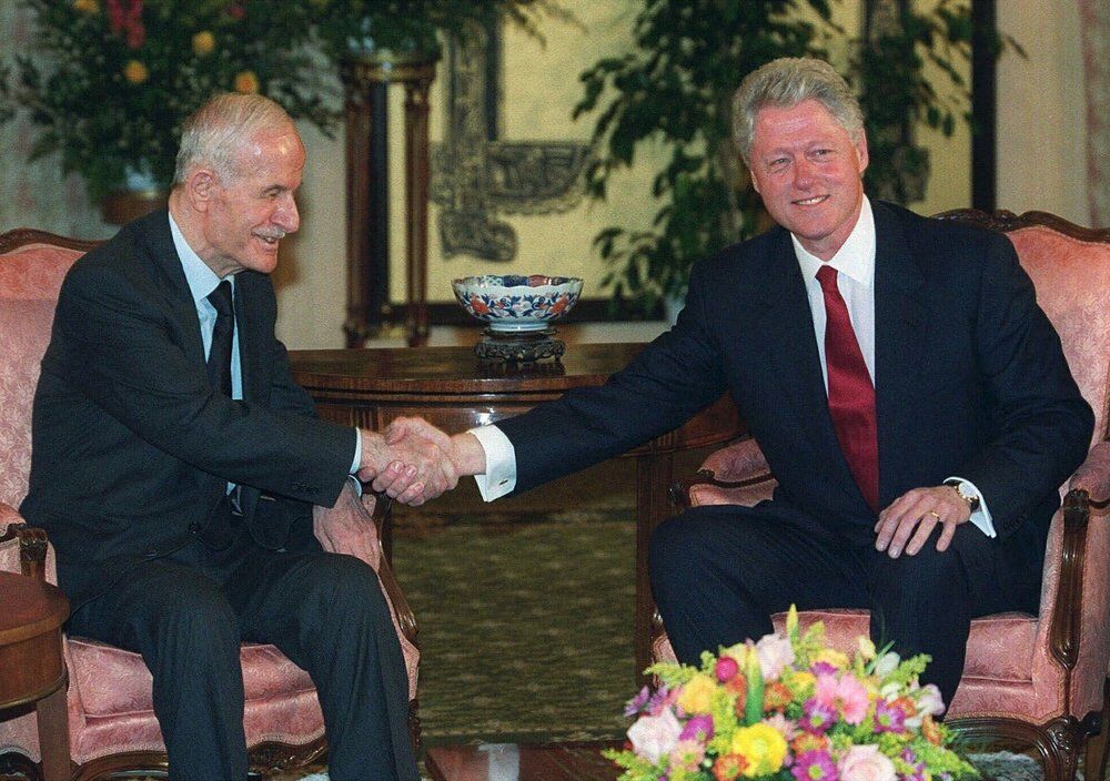 President Bill Clinton Shakes Hands With Syrian President Hafez Assad ...